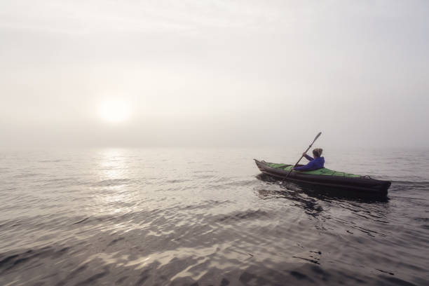 istock Kayaking during foggy sunset 975971706