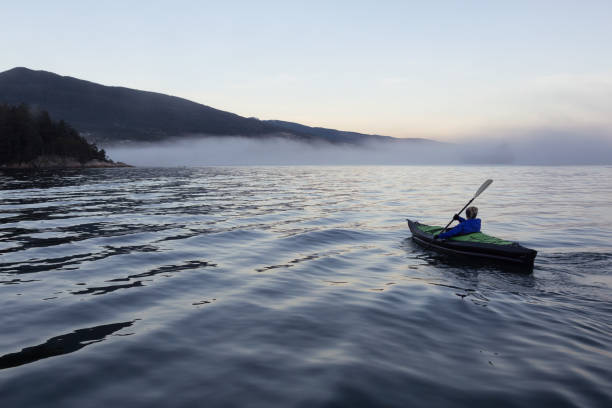 istock Kayaking during a foggy sunset 975972804