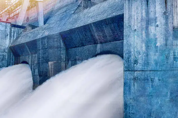 Streams of water from turbines of a hydroelectric power station.