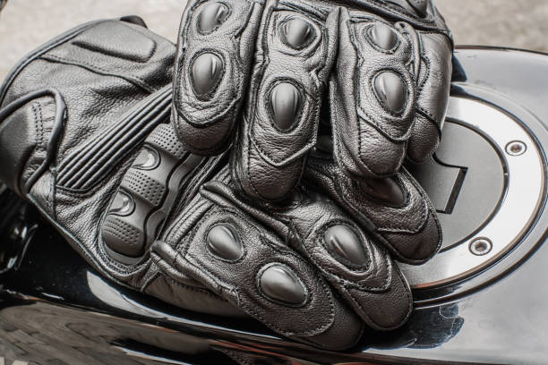 istock Moto gloves and motorcycle close up 975979308