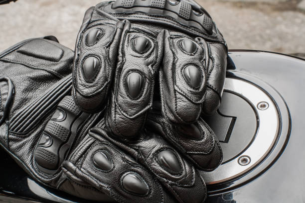 istock Moto gloves and motorcycle close up 975979324