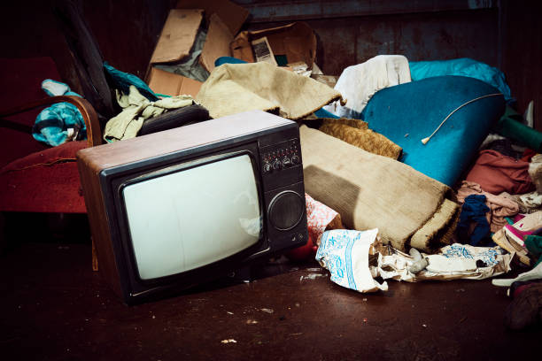 istock Old olectronic waste and other things in a large iron container waiting to be shipped for recycling 975980868