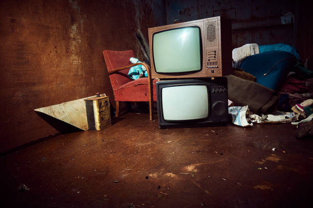 istock Old olectronic waste and other things in a large iron container waiting to be shipped for recycling 975980996