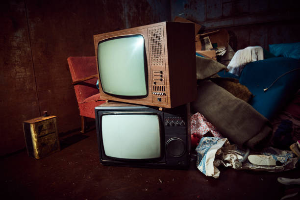 istock Old olectronic waste and other things in a large iron container waiting to be shipped for recycling 975981242