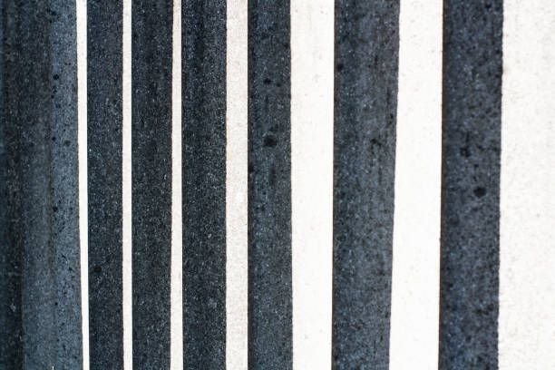 istock Abstract concrete lines crossed with sunlight 975989056