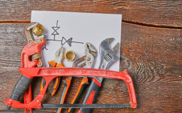 istock Workshop bench. Variety of hand tools on a wooden table, top view, copy space 976000168