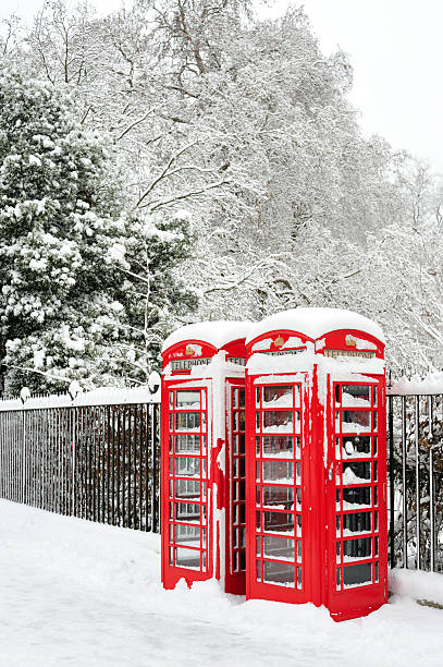 Landscape image of a traditional telephone box on a snowy Dartmoor