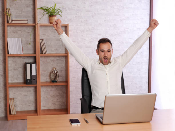 istock Young man at home celebrating a goal from his team. 976010798