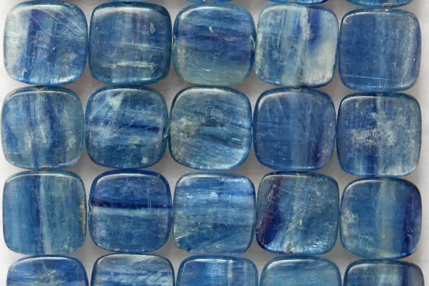 Photo beads of natural stone Kyanit. Natural mineral blue kyanite