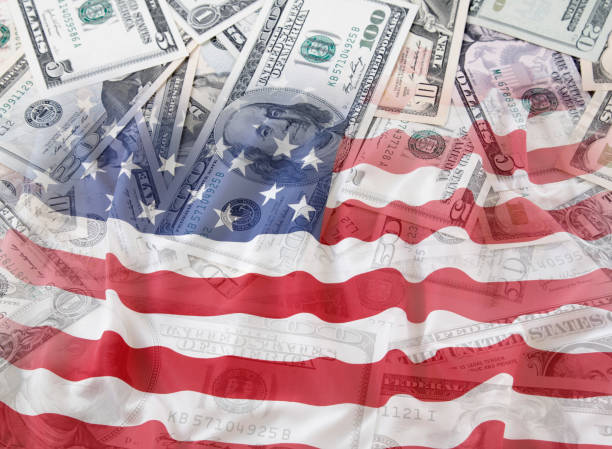 istock USA flag and cash 976017784