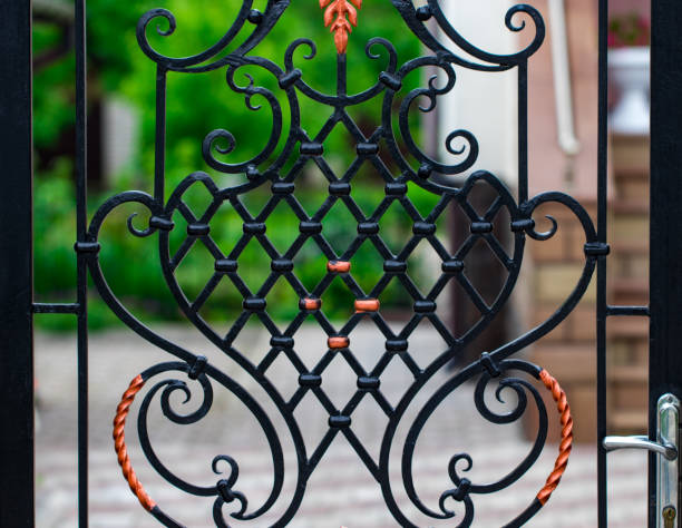 istock wrought-iron gates, ornamental forging, forged elements close-up 976041204
