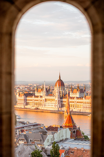 Captured from a Lofty Perspective,an Aerial Drone Reveals the Sun Kissed Elegance of the Szechenyi Chain Bridge Gracing the Danube River Amidst the Charming Cityscape of Budapest,Hungary. The Scene Radiates with the Warmth of a Sunny Day