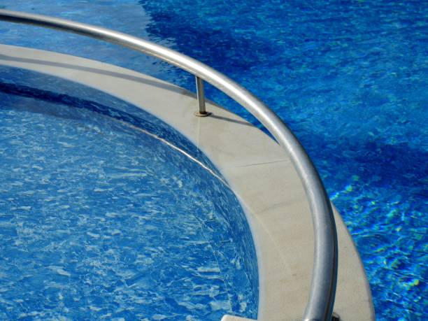 istock Swimming pool with turquoise water 976077164