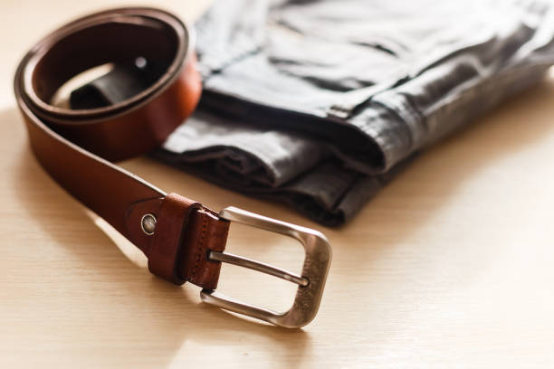 istock Still life with blue jeans on wooden background 976083890