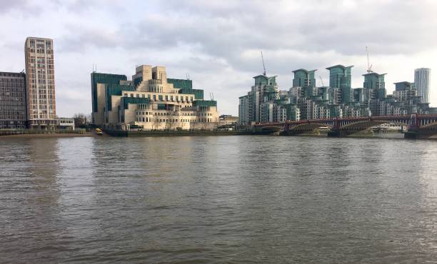 A view across the river Thames of the MI6 building A view across the river Thames of the MI6 building mi6 stock pictures, royalty-free photos & images