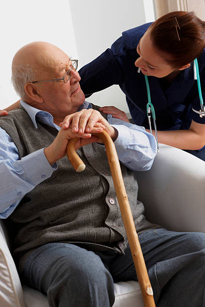 istock Senior man being visited by a nurse at home 97609637