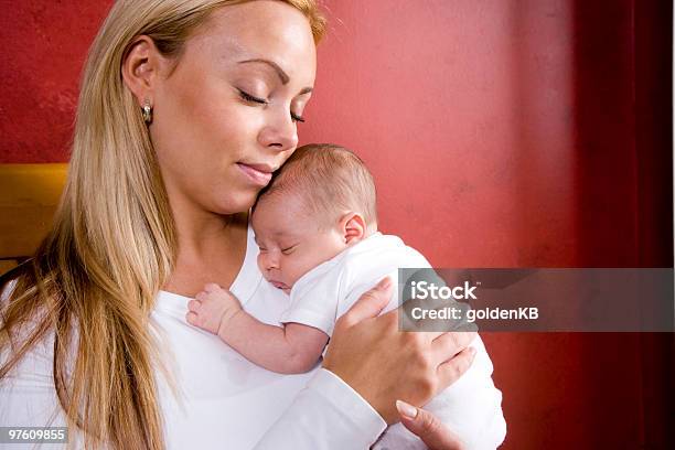 Mother Holding Newborn Baby In Rocking Chair Stock Photo - Download Image Now - Baby - Human Age, Sleeping, Rocking Chair