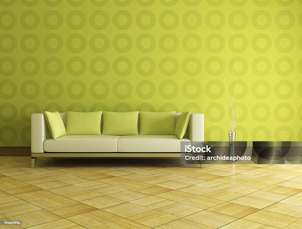Modern green couch and wallpaper with a wood floor white and green modern sofa in front a geometrical green wallpaper Geometric Shape Stock Photo