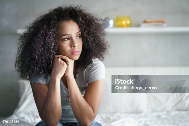 Depressed Hispanic Girl With Sad Emotions And Feelings Stock Photo - Download Image Now