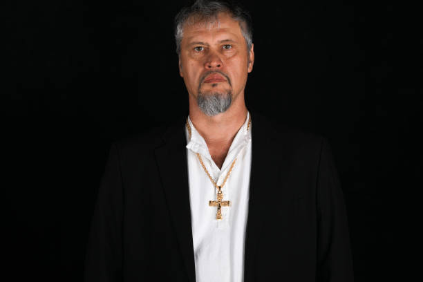 istock portrait of a mature man in a studio on a black background 976151128