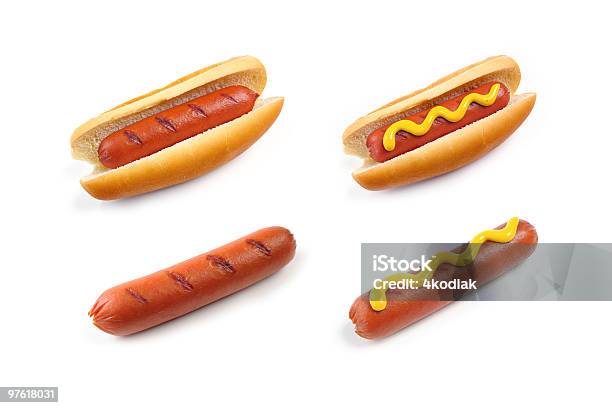 Four Hot Dogs With And Without Buns And Mustard On White Stock Photo - Download Image Now