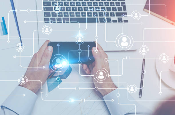 istock Businessman holding smarphone, global network 976197564