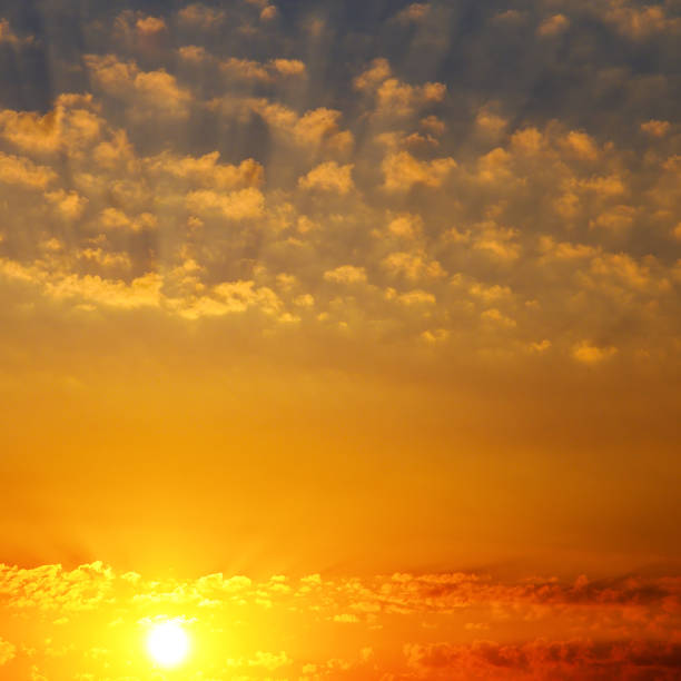 istock Cloudy sky and bright sunrise over the horizon. 976199838