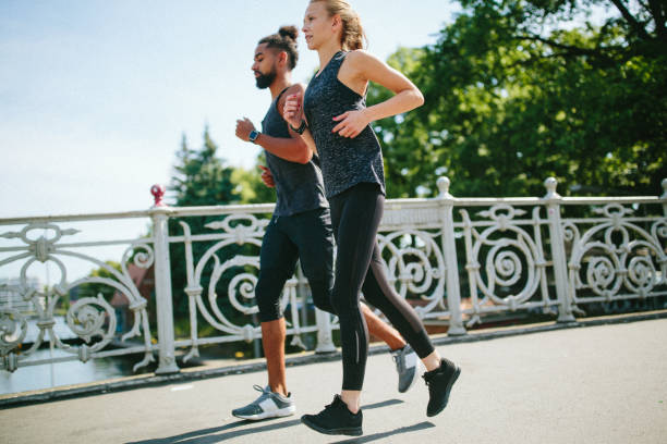istock Multi-ethnic couple jogging in the city. 976211032