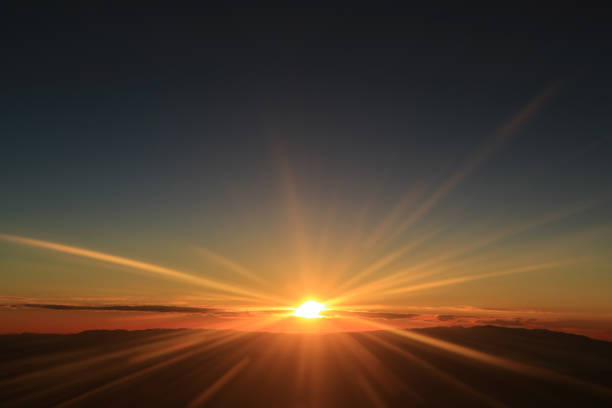 istock Fantastic view of sunrise over the clouds seen from airplane window 976221610