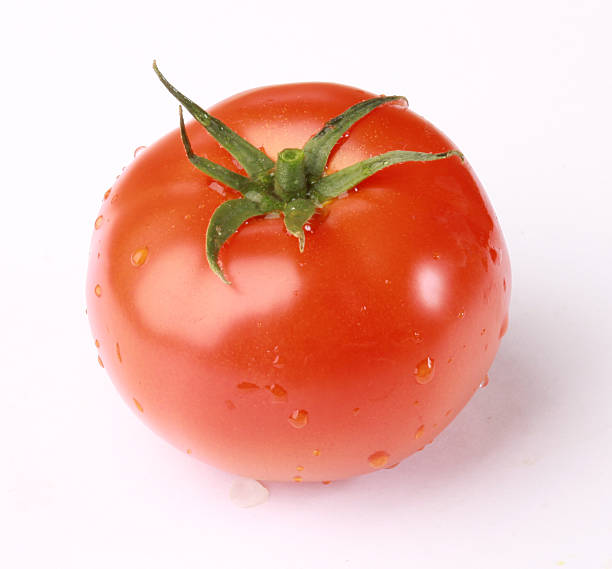 Tomato with drops stock photo