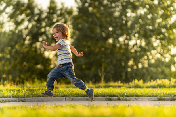 istock Happy little boy running in nature 976252538