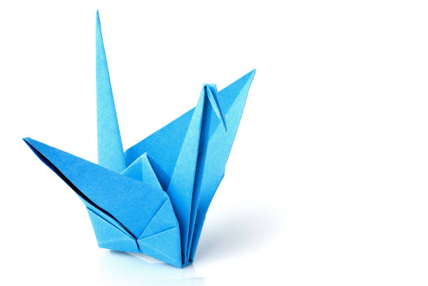 istock Blue origami crane; bird isolated. 976254932
