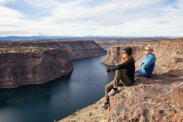 istock Friends enjoying the view by the cliff 976281508