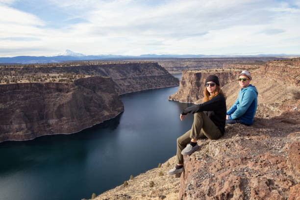 istock Friends enjoying the view by the cliff 976282036