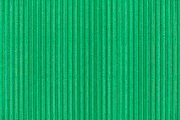 istock Full frame backdrop green colored texture of corrugated  paper sheet. 976293804