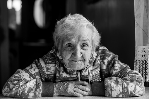 Black and white portrait of an elderly woman.
