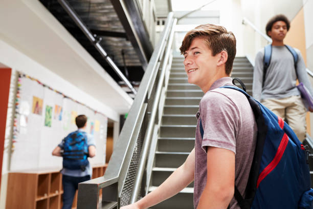 istock High School Students Walking Down Stairs In Busy College Building 976317160