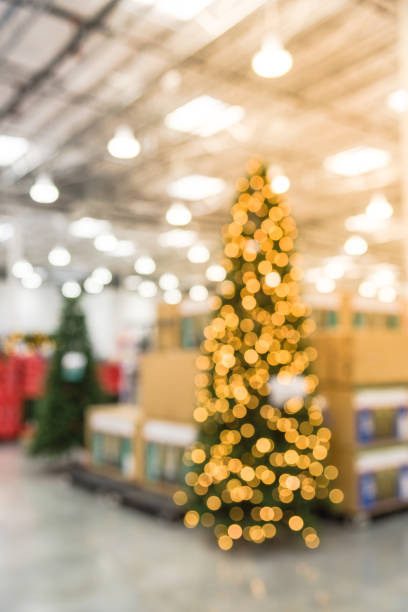 istock Motion blurred huge Christmas tree decoration at wholesale store 976317810