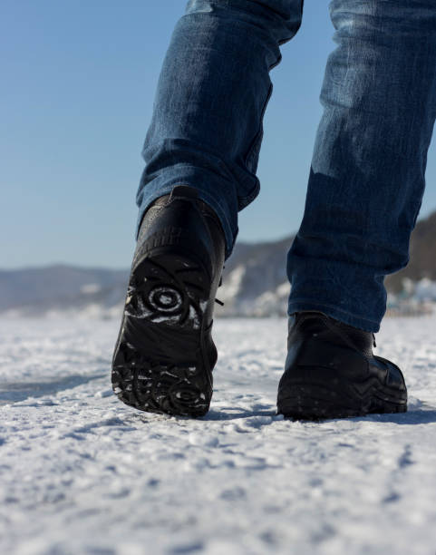 istock winter walk. Walking. Men's legs. Lifestyle. 976317916