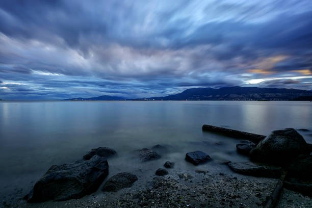 istock beach at sunset, Vancouver, British Columbia 976321470