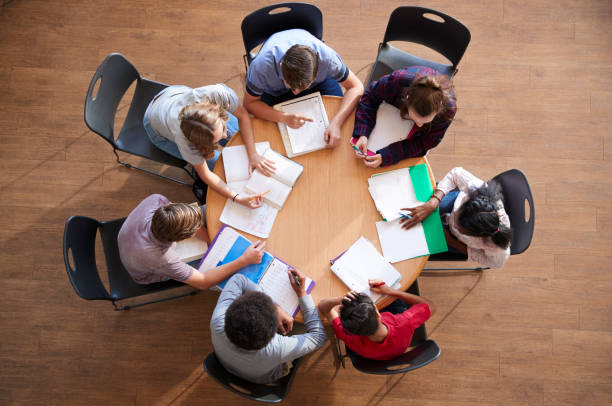 Overhead Shot Of High School Pupils In Group Study Around Tables Overhead Shot Of High School Pupils In Group Study Around Tables escort 12 gauge shotgun price stock pictures, royalty-free photos & images
