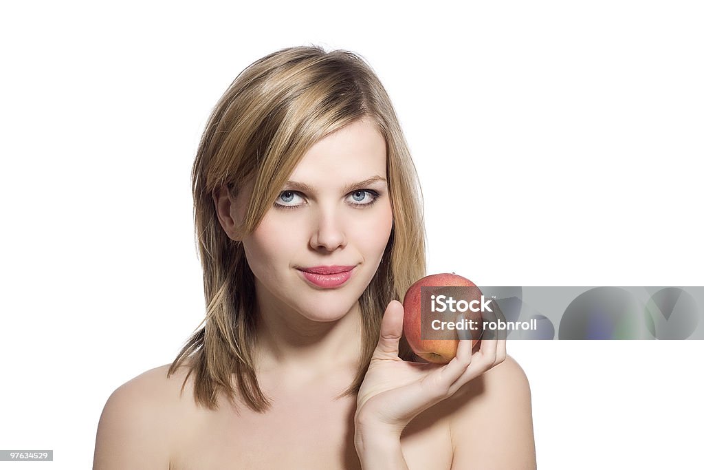 Schöne junge blonde Frau mit einem roten Apfel - Lizenzfrei Abnehmen Stock-Foto