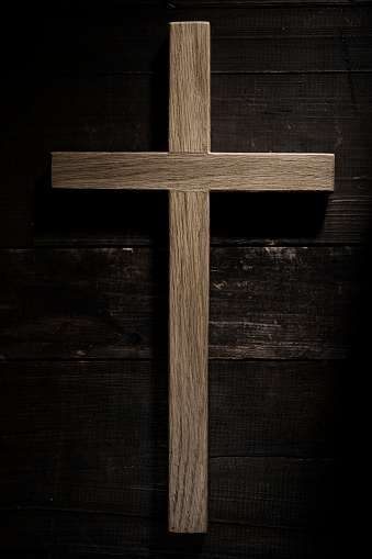 Wooden cross on grunge background