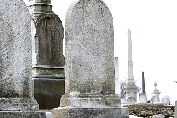 istock Old Weather Worn Tombstones 97635060