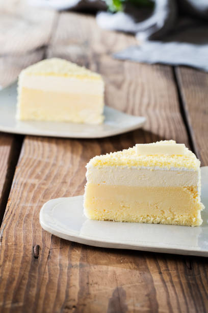 istock Delicious cake in white plate on wooden table background 976353446
