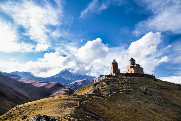 istock Gergeti Tsminda Sameba church in Stepantsminda village, Georgia 976359738
