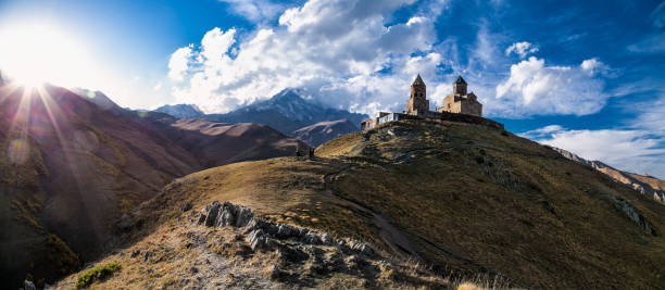 istock Gergeti Tsminda Sameba church in Stepantsminda village, Georgia 976359782