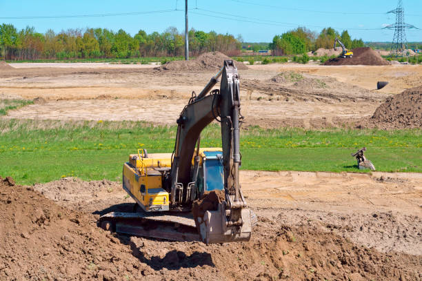 les travaux de pelle comme un seau, terrassement en l’espèce, l’excavateur creuse le sol - évolution de lespèce photos et images de collection