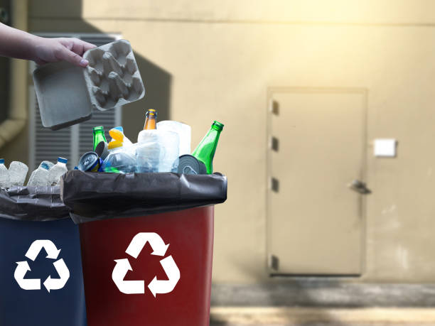 istock man hand putting plastic reuse for recycling concept environmental protection world recycle 976370248