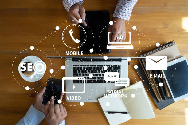 istock DIGITAL MARKETING new startup project MILLENNIALS Business team hands at work with financial reports and a laptop 976370254